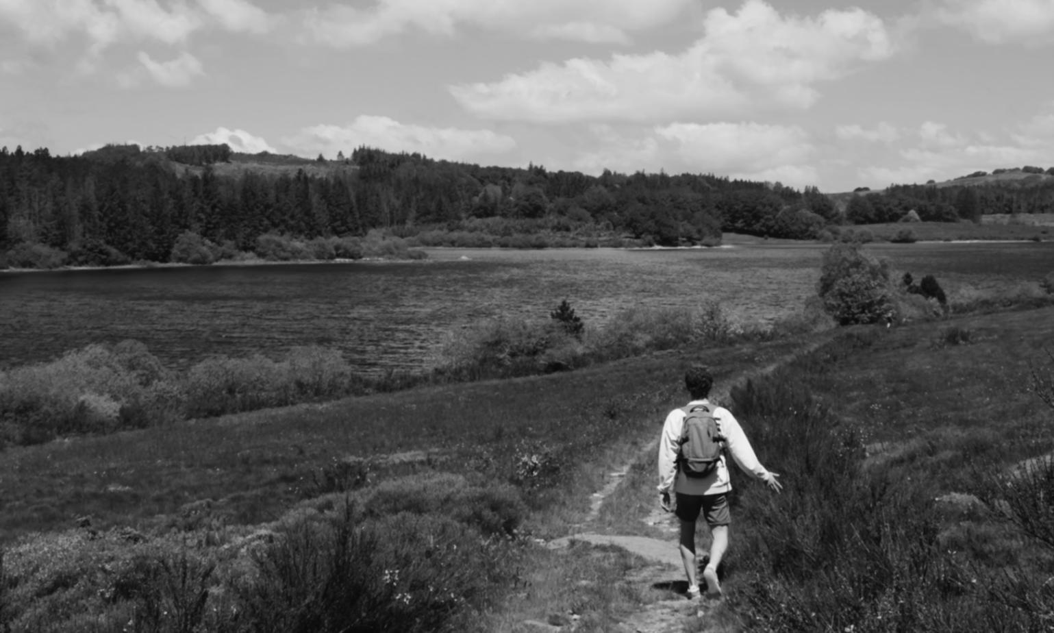 Fishing instructor demonstrating advanced casting technique with rod and reel setup